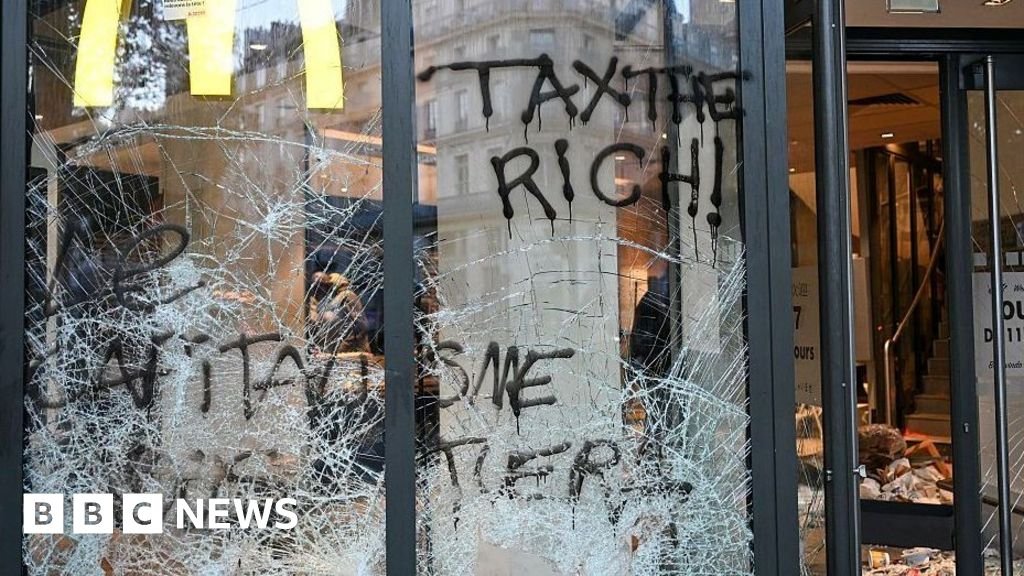 France protests: Burnt out cars and shattered glass on Paris streets after protests turn to riots and looting