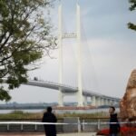 Kim Jong Un arrives in China via newly opened border bridge