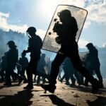 Macron slams ‘failures’ over protest unrest in France but refuses his interior minister’s resignation