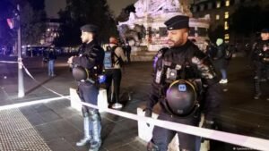 France bans protests in parts of Paris as Macron slams Trump comment