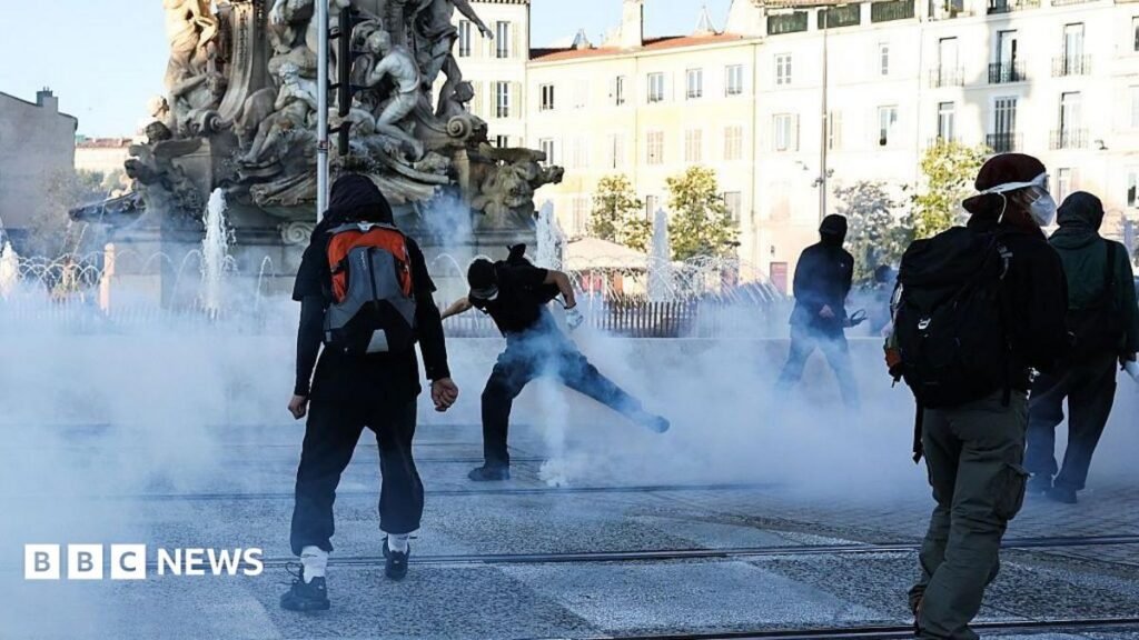 Dozens arrested in Paris as day of protests begins across France – follow live