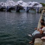 Video. Crowds flock to JR’s giant cave installation on Paris’ Pont Neuf