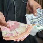 Indonesian rupiah falls to record low against US dollar
