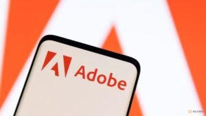 Adobe raises annual revenue forecast, CFO to exit