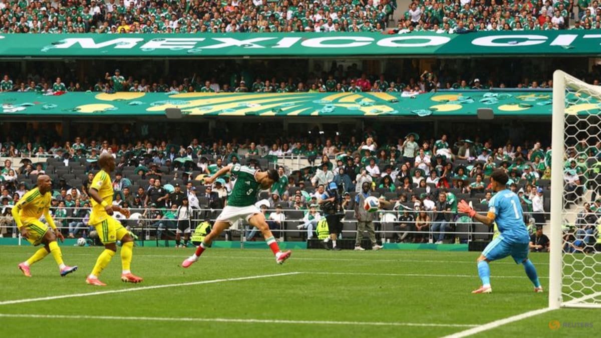 Mexico get World Cup party started with 2-0 win over nine-man South Africa