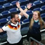 Rain sends Germany and Curacao fans on pre-match hunt for umbrellas and beer
