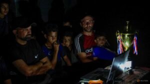 Gazans displaced by war watch World Cup from the ruins
