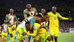 Fuelled by anger, South Africa take surprise place in World Cup last 32