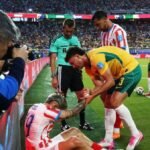 Paraguay coach concerned after player clatters into pitch-side advertising boards