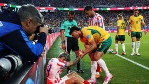 Paraguay coach concerned after player clatters into pitch-side advertising boards