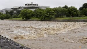 Four injured, flights cancelled in Japan as twin storms approach