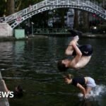 Parisians cool off in canal amid ‘red alert’ heatwave