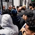 Spain offers legal status to migrants