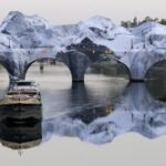 Christo-like art project turns Parisian bridge into cave