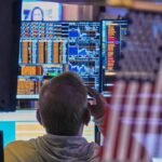 Oil drops, stocks mostly higher despite AI concerns