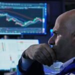Tech rebound lifts Dow to record, yen hits 40-year low against dollar