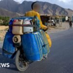 The bikers battling extreme heat and armed conflict to smuggle Iranian fuel to Pakistan