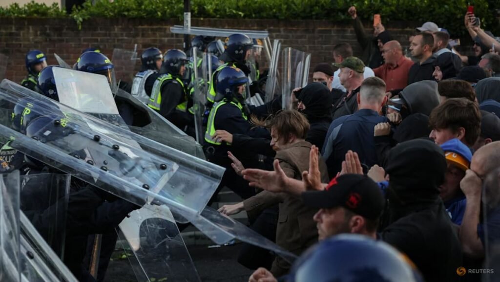 UK interior minister condemns violent reaction to handcuffed student’s murder