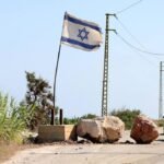 In south Lebanon, Israel flag and checkpoint mark start of occupation