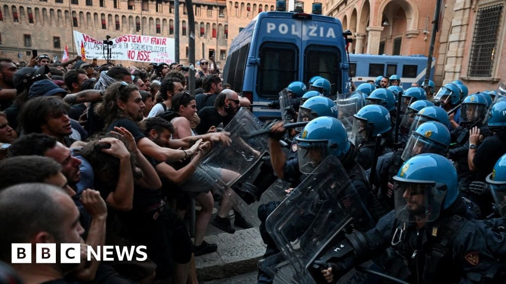 Italy protests: Dozens hurt in Bologna after man dies while being restrained by police