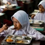 Some remote Indonesian communities still await free meals as programme resumes after review