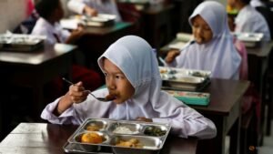 Some remote Indonesian communities still await free meals as programme resumes after review