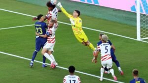 Ten-man United States beat Bosnia 2-0 to reach World Cup round of 16