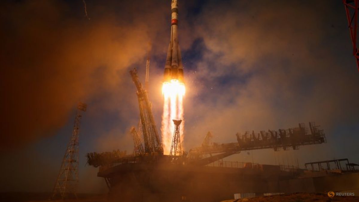 Russia sends American and two cosmonauts to space station with rare NASA chief visit