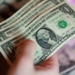 Dollar near one-month low as cooling inflation curbs Fed hike bets