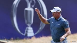 Burns seizes Open lead, DeChambeau shrugs off penalty to stay in the mix
