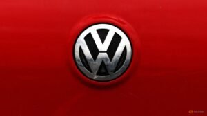 Volkswagen profit plunges as carmaker weighs mass job cuts