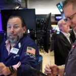Stocks claw back some losses; yields hold near highs as inflation fears linger