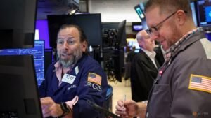 Stocks claw back some losses; yields hold near highs as inflation fears linger