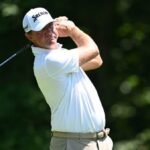 Glover says mid-round shoe removal about spike marks, not AimPoint protest