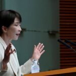 Japan PM vows to proceed with temporary cut in sales tax
