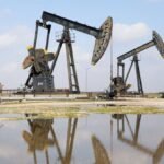 Oil falls on slightly improved flows through Gulf; set for monthly gain