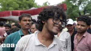 Protesters celebrate resignation of India’s education minister