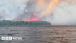 Watch: Residents flee massive Canadian wildfire by boat