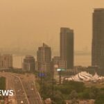 Orange haze from Canada wildfires seen in Ontario and northern US