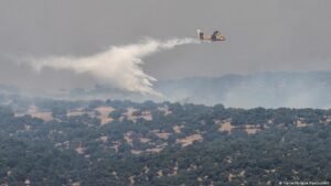 Europe wildfires: Thousands flee as fires spread, merge