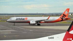 Jetstar to charge for carry-on bags in overhead lockers