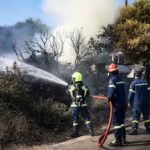 Two dead, hundreds evacuated from fires on island near Athens