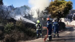 Two dead, hundreds evacuated from fires on island near Athens