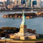 Man arrested after boat capsizes near Statue of Liberty killing woman and infant