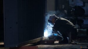 Japan’s factory output surges to near 12-year high in July, PMI shows