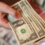 Dollar hits 3-month low vs euro, pares losses after Treasury move