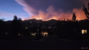Tens of thousands evacuated as fire bears down on US city