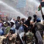 Indian police use water cannon at new protest over test paper leaks
