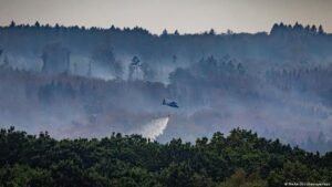 Germany news: Friedrich Merz visits area struck by fires