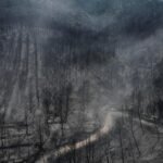 Spain battles forest fire a short drive from flash flood